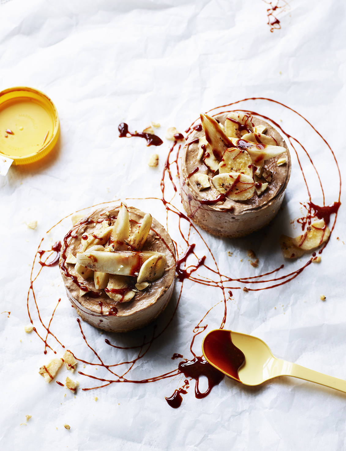 Food photography showing banana cheesecakes with a drizzle of marmite