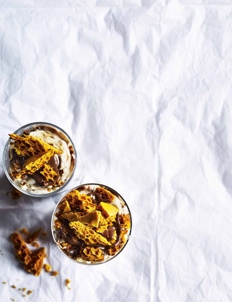 Food photography showing two bowls of honeycomb