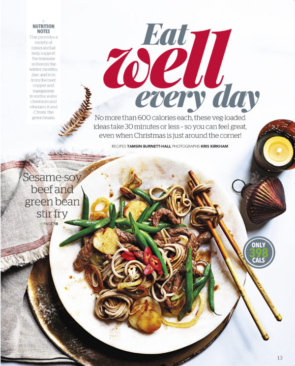 Creative food photography showing front cover of Eat Well Every Day magazine depicting a beef stir fry,plated with chopsticks ready to eat
