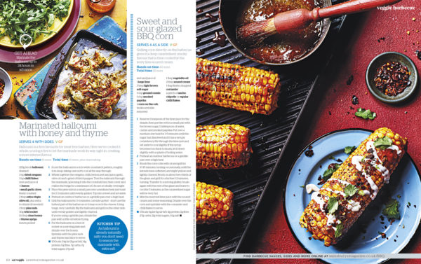 Creative food photography showing cooked corn on the cob, drizzled with sauce